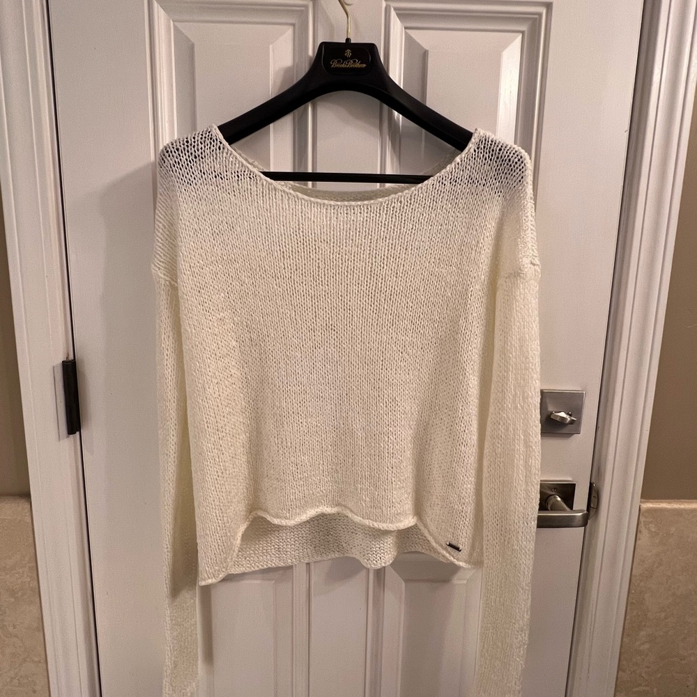 White chainmail sweater.